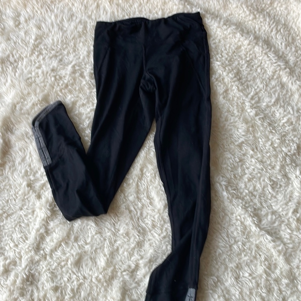 Black workout leggings with ankle detail